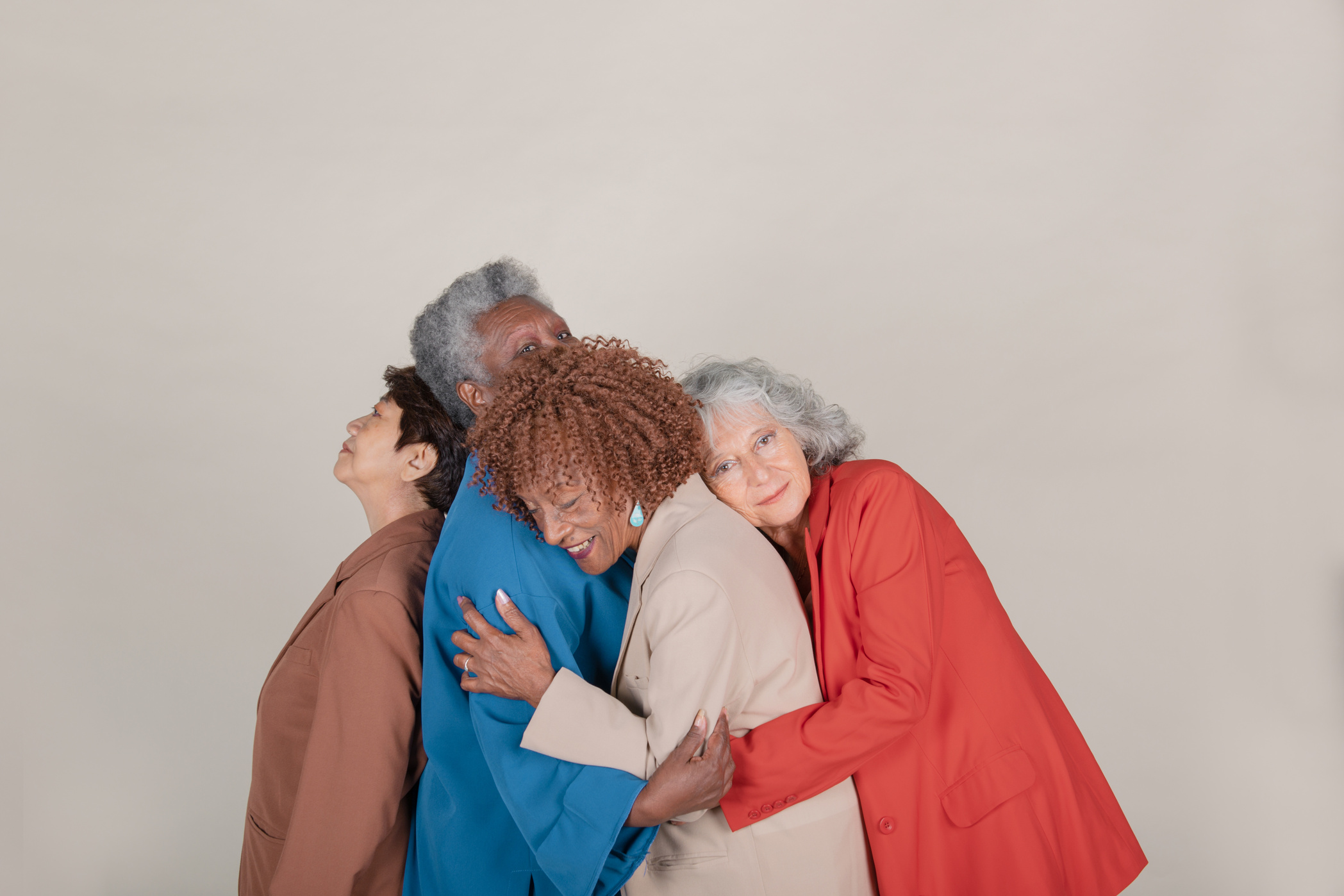 Group of Diverse Senior Women Hugging Each Other